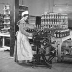 A factory worker manually bottling Heinz Ketchup 1890s POSTER 24 X 18 Inches